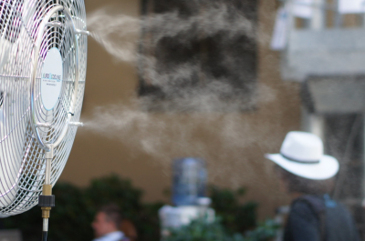 A fan with cooling spray.
